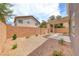Private backyard offers low-maintenance landscaping, block wall, and a covered patio area at 9766 Marcelline Ave, Las Vegas, NV 89148