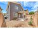 The backyard offers low maintenance landscaping and a covered patio for relaxation at 9766 Marcelline Ave, Las Vegas, NV 89148