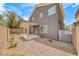 Fully fenced backyard offers a covered patio, low maintenance landscaping, and privacy at 9766 Marcelline Ave, Las Vegas, NV 89148