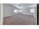 Bright bedroom featuring carpet, neutral walls, and plenty of natural light from multiple windows at 9766 Marcelline Ave, Las Vegas, NV 89148