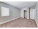 Neutral bedroom offers plush carpet, closet, and natural light from the window at 9766 Marcelline Ave, Las Vegas, NV 89148