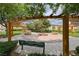 Inviting community park featuring covered seating areas, benches, and a charming fire pit for gatherings at 9766 Marcelline Ave, Las Vegas, NV 89148