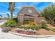 Attractive community entrance sign amid colorful flowerbeds and lush landscaping, creating a welcoming atmosphere at 9766 Marcelline Ave, Las Vegas, NV 89148