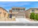 Two story home featuring neutral toned stucco, two car garage and low maintenance landscaping at 9766 Marcelline Ave, Las Vegas, NV 89148