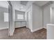 Bright hallway with carpet, built-in cabinets, and plenty of natural light from the window at 9766 Marcelline Ave, Las Vegas, NV 89148