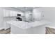 White kitchen showcasing stainless steel appliances, white cabinets and quartz countertops at 9766 Marcelline Ave, Las Vegas, NV 89148