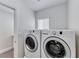 Convenient laundry area featuring modern, full-size washer and dryer appliances at 9766 Marcelline Ave, Las Vegas, NV 89148