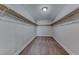 Walk-in closet with shelving, carpet floors, and plenty of space for storage at 9766 Marcelline Ave, Las Vegas, NV 89148