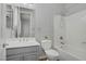 Bathroom with gray vanity, white countertops, and a shower-tub combo at 9779 Mosaic Canyon Ct, Las Vegas, NV 89149