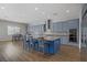 Bright, open kitchen with a large island, modern appliances, and ample counter space, great for entertaining at 9779 Mosaic Canyon Ct, Las Vegas, NV 89149