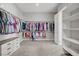 Large walk-in closet with carpet, abundant shelving, and clothes racks at 9779 Mosaic Canyon Ct, Las Vegas, NV 89149