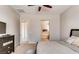 Cozy bedroom with a ceiling fan, natural lighting, a bed, and carpet at 10262 Havasu Falls St, Las Vegas, NV 89141