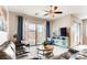 Bright and airy living room features a ceiling fan, patio access, and comfortable seating at 10262 Havasu Falls St, Las Vegas, NV 89141