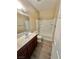 This bathroom features a vanity, mirror, toilet, and bathtub with shower head at 10455 Alpine Edge Ave, Las Vegas, NV 89129