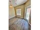Bonus room features laminate flooring, a window with blinds and access to an exterior door at 10455 Alpine Edge Ave, Las Vegas, NV 89129