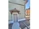 Charming townhome entrance with a well-lit walkway and stone landscaping at 10455 Alpine Edge Ave, Las Vegas, NV 89129
