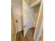 Hallway leading to an open closet area with laminate flooring at 10455 Alpine Edge Ave, Las Vegas, NV 89129