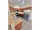 The kitchen features stainless steel appliances, wood cabinets, and ample counter space at 10455 Alpine Edge Ave, Las Vegas, NV 89129