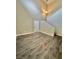 This living room features tall ceilings, laminate floors, and a staircase at 10455 Alpine Edge Ave, Las Vegas, NV 89129