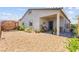 Low maintenance backyard with a covered patio and gravel landscaping at 10951 Stone Crossing Ave, Las Vegas, NV 89166