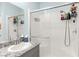 Stylish bathroom features a granite countertop, white cabinets and a tiled shower at 10951 Stone Crossing Ave, Las Vegas, NV 89166