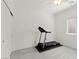 Well-lit spare room with a new treadmill, and easy access to closet at 10951 Stone Crossing Ave, Las Vegas, NV 89166