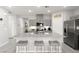 Modern kitchen with granite countertops, stainless steel appliances, and a spacious island at 10951 Stone Crossing Ave, Las Vegas, NV 89166