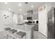 Well-equipped kitchen featuring modern appliances, granite countertops, and a convenient breakfast bar at 10951 Stone Crossing Ave, Las Vegas, NV 89166