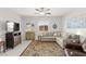 Comfortable living room with a sectional sofa, area rug, and stylish decor at 10951 Stone Crossing Ave, Las Vegas, NV 89166