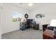 Bright and airy office space with a large window, desk, and comfortable seating at 10951 Stone Crossing Ave, Las Vegas, NV 89166