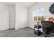 Well-lit office space with sliding door closet, neutral carpet and a large window at 10951 Stone Crossing Ave, Las Vegas, NV 89166