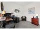 Well-lit office featuring a desk, printer, seating, and a small decorative wall display at 10951 Stone Crossing Ave, Las Vegas, NV 89166