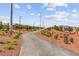 Wide community walking path with desert landscaping and distant mountain views at 10951 Stone Crossing Ave, Las Vegas, NV 89166