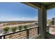A view of the street with partial desert landscape from the balcony at 11552 Ashy Storm Ave, Las Vegas, NV 89138