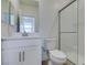 Bright bathroom featuring white cabinetry, shower, and fixtures at 11552 Ashy Storm Ave, Las Vegas, NV 89138