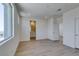 An open bedroom with light wood floors that adjoins the modern bathroom at 11552 Ashy Storm Ave, Las Vegas, NV 89138