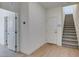 Inviting home entryway featuring sleek floors, modern design and staircase at 11552 Ashy Storm Ave, Las Vegas, NV 89138
