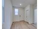 Bright foyer with stylish floors, a front door, and neutral walls at 11552 Ashy Storm Ave, Las Vegas, NV 89138