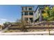 A view of the home's exterior, highlighting the tiered landscaping and modern design at 11552 Ashy Storm Ave, Las Vegas, NV 89138
