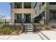 Contemporary three-story home with a stone facade and front yard landscaping at 11552 Ashy Storm Ave, Las Vegas, NV 89138