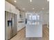 Modern kitchen with stainless steel appliances and quartz island at 11552 Ashy Storm Ave, Las Vegas, NV 89138