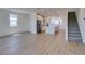 Bright and airy kitchen with stainless steel appliances and center island adjacent to stairs at 11552 Ashy Storm Ave, Las Vegas, NV 89138