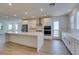 Spacious kitchen with stainless steel appliances, white cabinets, and large island at 11552 Ashy Storm Ave, Las Vegas, NV 89138