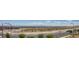 The community of new homes under construction in the distance at 11552 Ashy Storm Ave, Las Vegas, NV 89138
