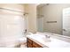 Bathroom featuring vanity, sink, mirror, and bathtub with shower at 11625 Cabo Del Verde Ave, Las Vegas, NV 89138