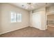 Bedroom with neutral walls, carpet, plantation shutters, and a closet at 11625 Cabo Del Verde Ave, Las Vegas, NV 89138