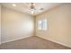Bedroom with neutral walls, carpet, ceiling fan, and window with plantation shutters at 11625 Cabo Del Verde Ave, Las Vegas, NV 89138