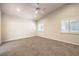 Spacious bedroom featuring neutral carpet, recessed lighting, and plantation shutters at 11625 Cabo Del Verde Ave, Las Vegas, NV 89138