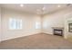 Comfortable bedroom with neutral carpet, fireplace, ceiling fan, and plantation shutters at 11625 Cabo Del Verde Ave, Las Vegas, NV 89138
