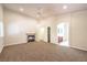 Large bedroom with neutral carpet, fireplace, ceiling fan, and ensuite bathroom at 11625 Cabo Del Verde Ave, Las Vegas, NV 89138